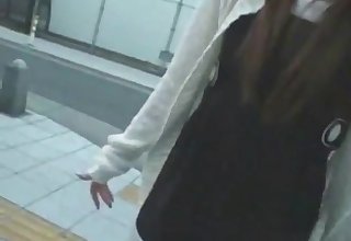 An Amateur Japanese Girl Reaching Into A Dick Relative to A Box